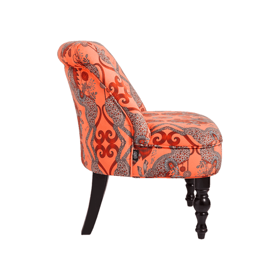 Coral | A sode view of the Caspian Coral Velvet Langley chair by Emma J Shipley & Clarke & Clarke