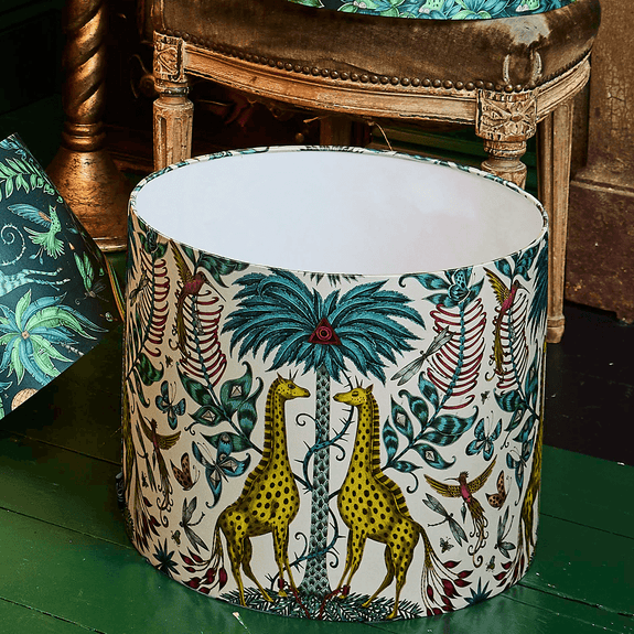 The Large Kruger Lampshade features a set of curious giraffes with stripped manes running down their back, discover this piece that will light up your home interior