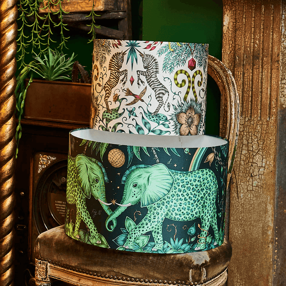 The Zambezi Silk Lampshade in large with the Small Kruger lampshade with leaves and foliage running across the bottom as well as rainbows and palm trees sneaking in the top