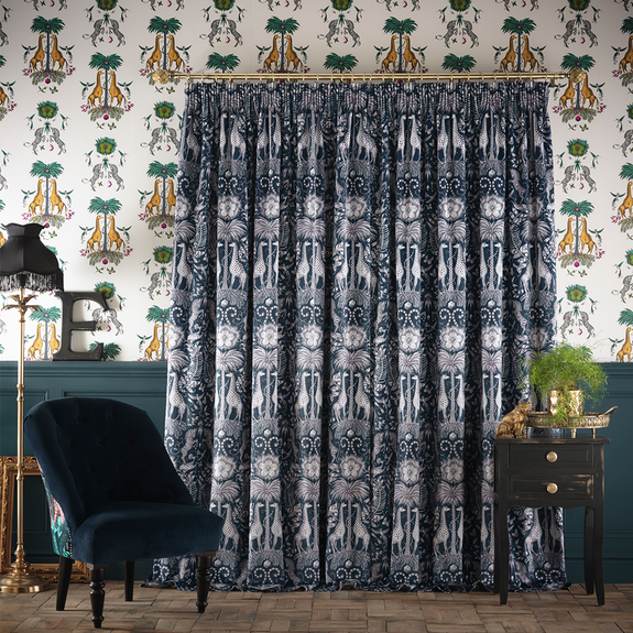 The Kruger Navy Velvet curtains paired with the Yellow Creatura wallpaper are the perfect Emma J Shipley pairing, made in collaboration with interior experts Clarke & Clarke