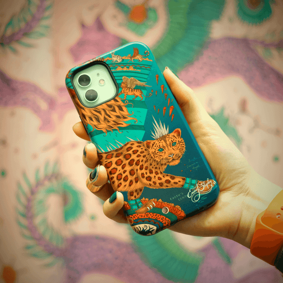 Teal | Snow Leopard phone case, featuring a striking leopard under a surrealist moon, with angelic, winged creatures accompanying the snow leopard on its journey. Inspired by Dante’s Inferno and Ingmar Bergman’s film “The Seventh Seal”, this phone case will add surrealism to your everyday, and would make the perfect gift for any animal lover. Designed in London by Emma J Shipley