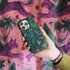 Quetzal Phone Case in Teal in hand, with Lynx background. Designed by Emma J Shipley in London