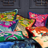 Forest | The Snow Leopard Luxury Velvet Cushion in Forest, featuring enchanting blues, striking greens and flame reds with opulent ruche fringing. Designed by Emma J Shipley, inspired by Dante’s Inferno and Paradiso from the 14th century and Ingmar Bergman’s film “The Seventh Seal