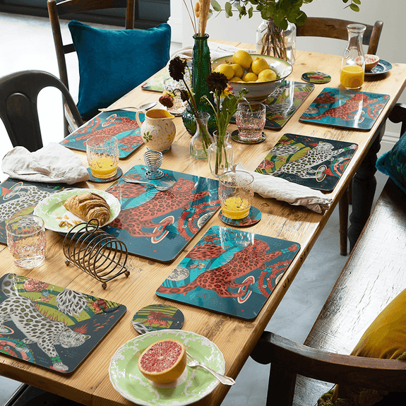 Forest | 1 | 4 | The Snow Leopard tableware collection including the Teal Coaster that features rust reds and vibrant teals designed by Emma J Shipley and made with Jamida