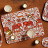 Medium | Large | 1 | 4 | Decorative placemat with red orange elephants, birds, and other animals on a white background