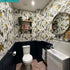 Gold | The Gold Audubon Wallpaper in a bathroom designed by Emma J Shipley x Clarke & Clarke
