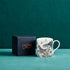 1 | 4 | Lost World fine bone china mug by Emma J Shipley with box styled in a home setting