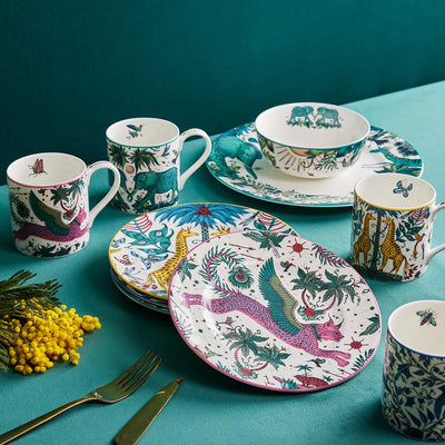 Zambezi Dinner Plates | The Explorer Dinner Set designed by Emma J Shipley, crafted in fine bone china by skilled artisans in Stoke on Trent UK, hand decorated with an exquisitely detailed and colourful design featuring leopard spotted elephants, a leaping gazelle, soaring hornbills in layers of teal, greens and neutrals, part of the Fine China Dining collection