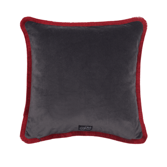 Coral | The back of the Wonder World Orange Cushion, with it's dark grey backing velvet and vibrant red trim round the edges, designed by Emma J Shipley
