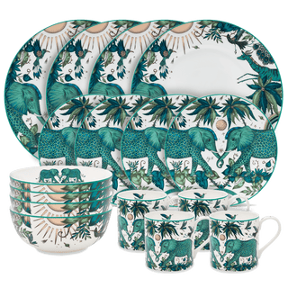 The Zambezi Dinner Set designed by Emma J Shipley, crafted in fine bone china by skilled artisans in Stoke on Trent UK, hand decorated with an exquisitely detailed and colourful design featuring leopard spotted elephants, a leaping gazelle, soaring hornbills in layers of teal, greens and neutrals, part of the Fine China Dining collection