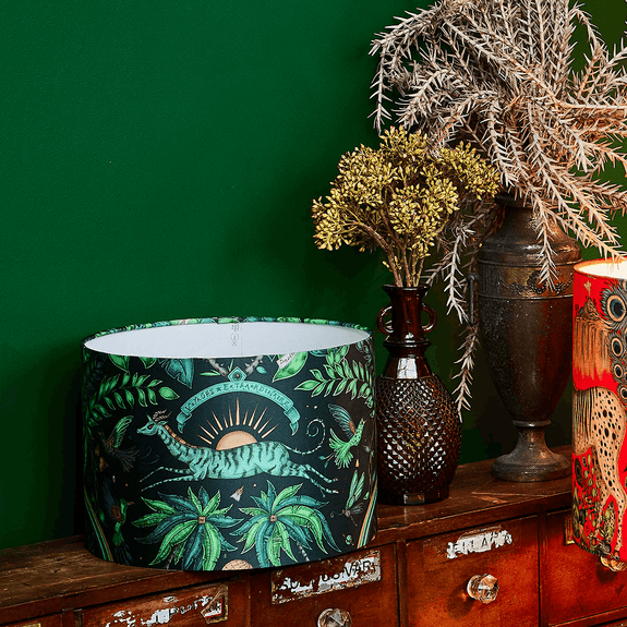 The Zambezi Silk Lampshade is perfect for adding a touch of maximalist lighting to your home interior with the deep teal and soft green tones that run throughout the design