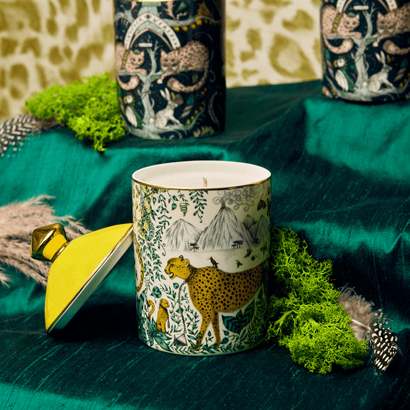 A closer look at the Cheetah candle with the lid, featuring real gold details with lemon zest and vetiver scents