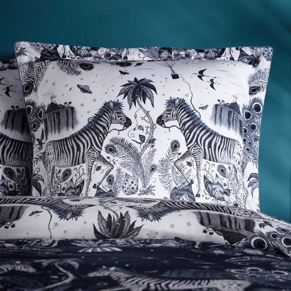 Navy/White | The Lost World Square Pillowcase in Monochrome Blue and navy is covered in Peacock tailed Zebras and mini floating parachutes, hand drawn by designer Emma J Shipley's travels. The hand-drawn illustration adorns the magical bedding set that guarantees to turn your bedroom into a maximalist dream world.