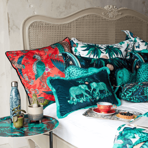 Teal/White | Velvet bolster cushion with the pillowcases, duvet cover also with the matching water bottle, tray table, small tray the perfect Emma J Shipley maximalist designer and interior experts Clarke & Clarke