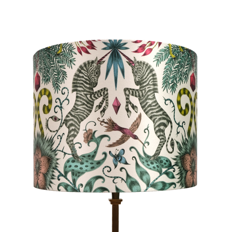 the Kruger Small silk lampshade shows of the Zebra part of the design with the birds, butterflies and flowers, with yellows, teals, blues and pinks running through the design