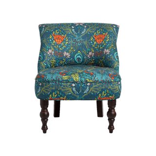 A bold, luxurious upholstered occasion chair featuring Animalia fabric in the Amazon design by Emma J Shipley designed in collaboration with Clarke & Clarke. Featuring a selection of jungle animals in Navy and teal