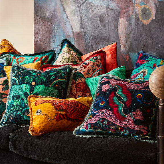 Gold | The Gold Tigris Bolster Cushion with the other cushions in the Luxury cushion collection with Zambezi and Lynx, designed by Emma J Shipley