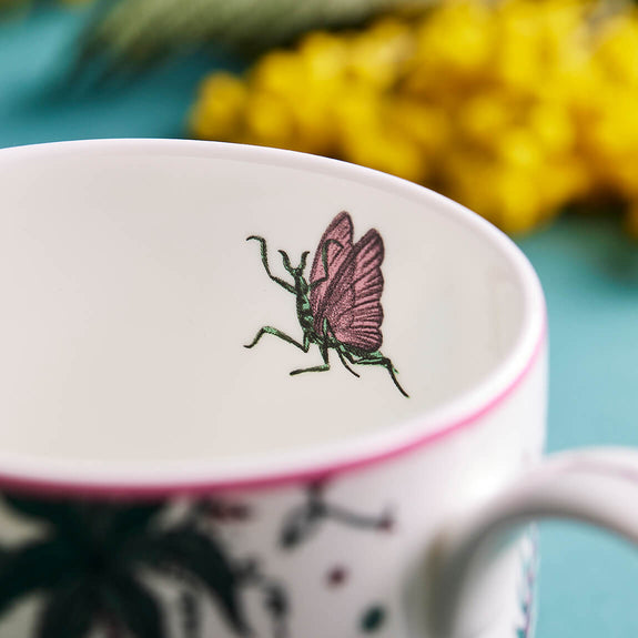 1 | Detail of the mantis on the inside of the Lynx Mug designed by Emma J Shipley, crafted in fine bone china by skilled artisans in Stoke on Trent UK, hand decorated with an exquisitely detailed and colourful artwork with a Lynx, leaping through a starry night sky surrounded by magical creatures in pink, magenta and verdant green shades - part of the Fine China Dining collection