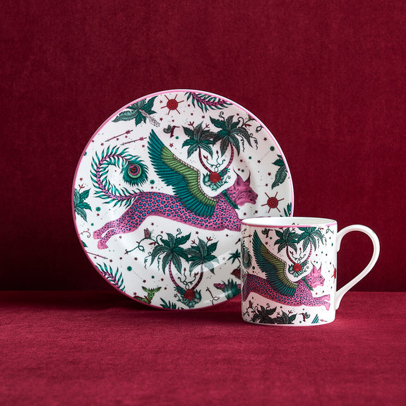 Lynx Side Plate and Mug designed by Emma J Shipley, crafted in fine bone china by skilled artisans in Stoke on Trent UK, hand decorated with an exquisitely detailed and colourful artwork with a Lynx, leaping through a starry night sky surrounded by magical creatures in pink, magenta and verdant green shades - part of the Fine China Dining collection