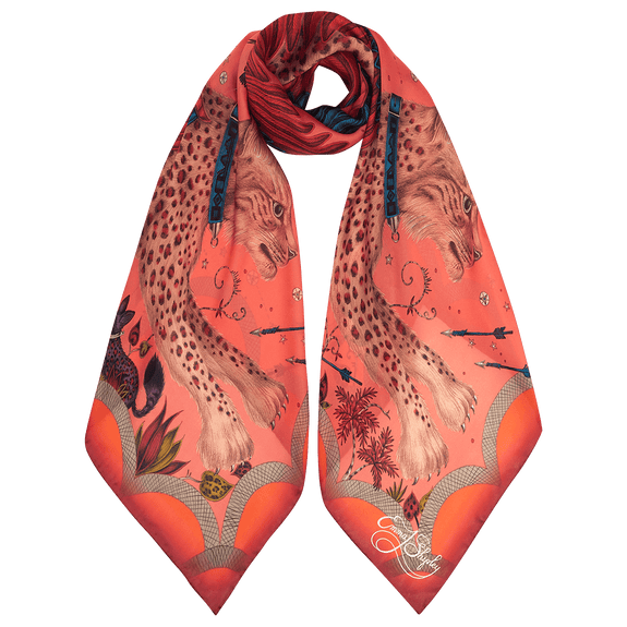 Autumn - Orange | Lynx Autumn Scarf tied up to show how it would look on, featuring peaches, burnt oranges and pops of blues and purples, designed by those 