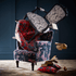 Red | The red velvet Amazon Langley Chair is designed by Emma J Shipley in collaboration with Clarke & Clarke. It features a playful scene inspired by the jungle upon a striking velvet fabric background