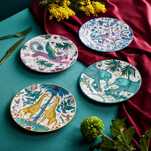 Zambezi Dinner Plates | The Explorer Side Plates designed by Emma J Shipley, crafted in fine bone china by skilled artisans in Stoke on Trent UK, hand decorated with an exquisitely detailed and colourful design featuring leopard spotted elephants, a leaping gazelle, soaring hornbills in layers of teal, greens and neutrals, part of the Fine China Dining collection