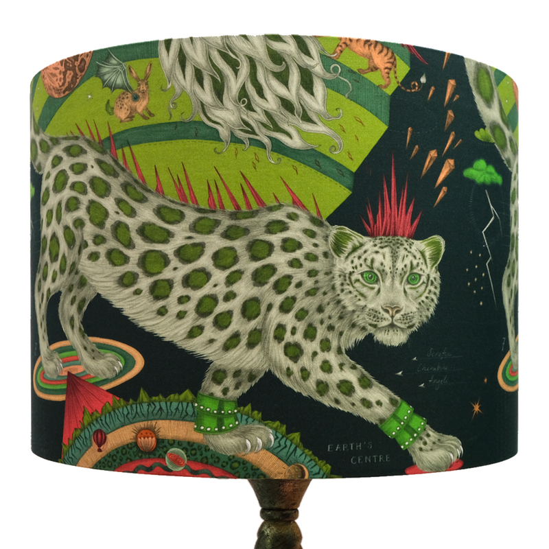 The Snow Leopard silk lampshade in the Forest colour designed by Emma J Shipley has leopard spots and a frosty crown and a fiery tail inspired by Dantes Inferno and His Dark Materials