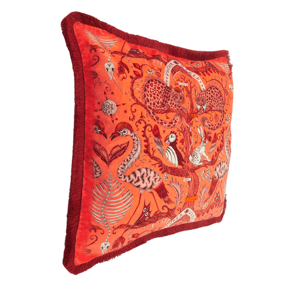 Coral | The Side of the Wonder World Orange Cushion showing the bright red trim paired with the velvet printed front, featuring Scottish Wildcats, puffins and flamingos 