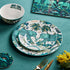 Zambezi Dinner set designed by Emma J Shipley, crafted in fine bone china by skilled artisans in Stoke on Trent UK, hand decorated with an exquisitely detailed and colourful design featuring leopard spotted elephants, a leaping gazelle, soaring hornbills in layers of teal, greens and neutrals, part of the Fine China Dining collection