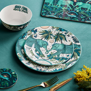 The Zambezi Dinner Set designed by Emma J Shipley, crafted in fine bone china by skilled artisans in Stoke on Trent UK, hand decorated with an exquisitely detailed and colourful design featuring leopard spotted elephants, a leaping gazelle, soaring hornbills in layers of teal, greens and neutrals, part of the Fine China Dining collection