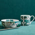 1 | Zambezi Mug, Bowl and Tray designed by Emma J Shipley, crafted in fine bone china by skilled artisans in Stoke on Trent UK, hand decorated with an exquisitely detailed and colourful design featuring leopard spotted elephants, a leaping gazelle, soaring hornbills in layers of teal, greens and neutrals, part of the Fine China Dining collection