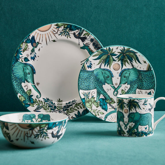 Zambezi Dinner Set designed by Emma J Shipley, crafted in fine bone china by skilled artisans in Stoke on Trent UK, hand decorated with an exquisitely detailed and colourful design featuring leopard spotted elephants, a leaping gazelle, soaring hornbills in layers of teal, greens and neutrals, part of the Fine China Dining collection
