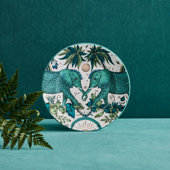 Zambezi Side plate designed by Emma J Shipley, crafted in fine bone china by skilled artisans in Stoke on Trent UK, hand decorated with an exquisitely detailed and colourful design featuring leopard spotted elephants, a leaping gazelle, soaring hornbills in layers of teal, greens and neutrals, part of the Fine China Dining collection