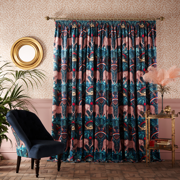 The Zambezi Navy Velvet curtains paired with the Blush Felis wallpaper are the perfect Emma J Shipley pairing, made in collaboration with interior experts Clarke & Clarke