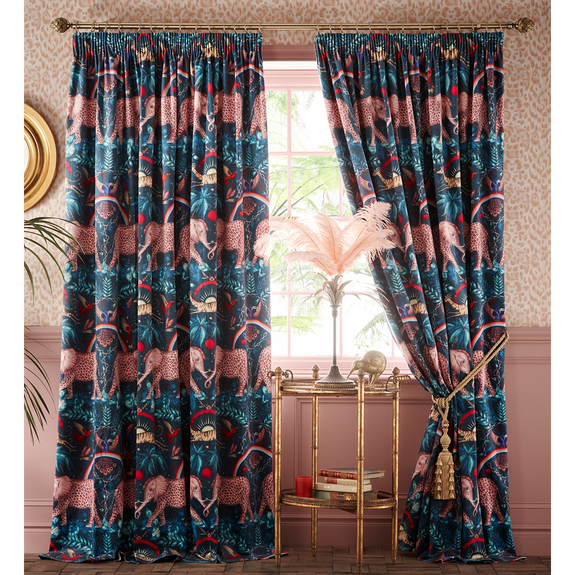 A drawn back style of the Zambezi Navy Velvet Ready made curtains designed by Emma J Shipley in collaboration with Clarke & Clarke