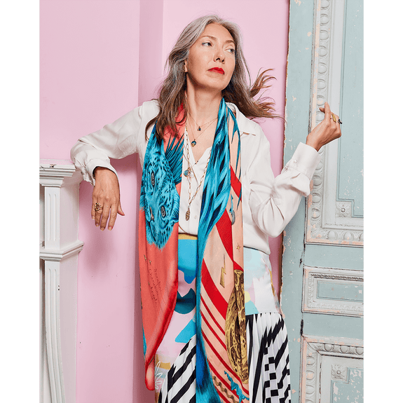 Spring - Turquoise | Tarra wears the Spring Snow Leopard Scarf with colours of bright turquoise waters & rich red spring fruit designed by Emma J Shipley with colour experts Red Leopard 